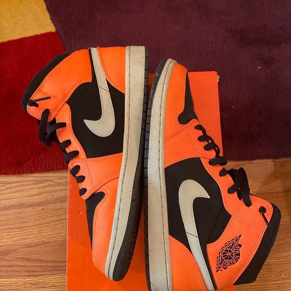 Nice pair of Orange Nike high top gyms.